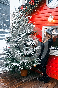 Beautiful russian girl in a cloud day in winter clothes having fun in Tverskaya Square in Christmas time