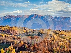 Beautiful rustic landscape in Magura village,Romania, with traditional romanian houses and Bucegi mountains in the background