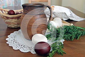 Rustic still life with clay jug and eggs