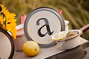 Rustic table setting with lettered plate.