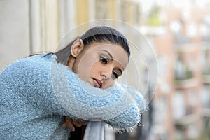 Beautiful sad and desperate hispanic woman suffering depression thoughtful frustrated