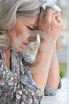 Beautiful sad elderly woman