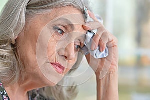 Beautiful sad elderly woman