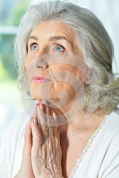 Beautiful sad elderly woman