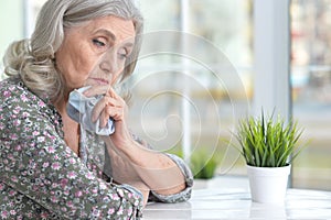 Beautiful sad elderly woman