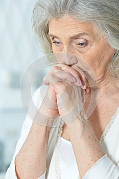 Beautiful sad elderly woman