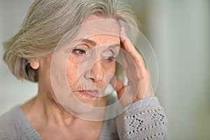 Beautiful sad elderly woman close-up