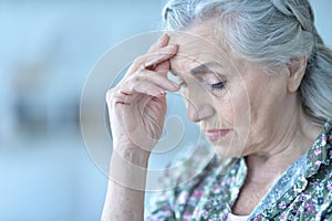 Beautiful sad elderly woman close-up