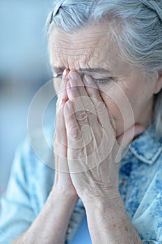 Beautiful sad elderly woman close-up