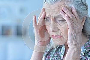 Beautiful sad elderly woman close-up