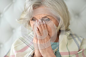 Beautiful sad elderly woman close-up