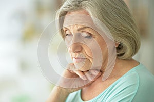 Beautiful sad elderly woman close-up