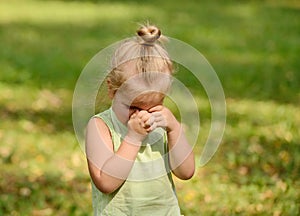 Beautiful sad little girl crying