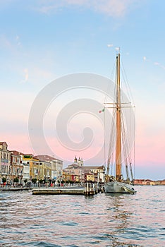 A beautiful sailing ship with the unmistakable backdrop of Venice, Italy photo