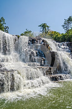 Beautiful Sala water falls near Labe with trees, green pool and a lot of water flow, Guinea Conakry, West Africa photo