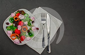 Beautiful salad with edible flowers and strawberry