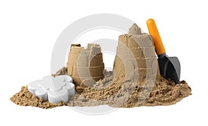 Beautiful sand castle and plastic beach toys isolated on white. Outdoor play