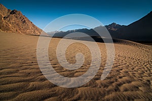 Beautiful sand dune and layer mountains in Nubra Valley