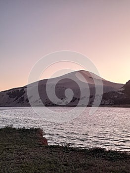 Beautiful sanddune at sunset with water