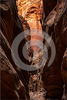 Beautiful Sandstone Wall Glows Orange At The End Of Slot Canyon Corridor