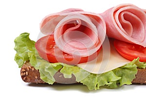 Beautiful sandwich with ham and vegetables isolated