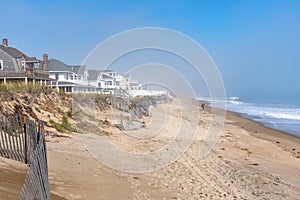 Beautiful sandy beach along the coast of New Hampshire on a misty autumn morning