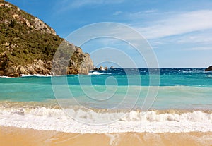 Beautiful sandy beach in a bay at Paleokastritsa in Corfu, Greece