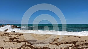 beautiful sandy beach in front of blue sea