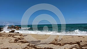 beautiful sandy beach in front of blue sea