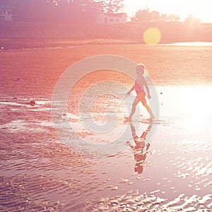 Beautiful sandy beach with little girl