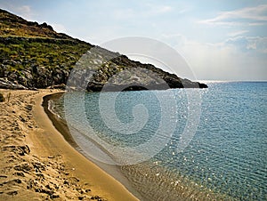 Beautiful sandy beach and overcast sky. Marmari in  Laconia, Greece