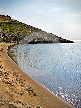Beautiful sandy beach and overcast sky. Marmari in  Laconia, Greece