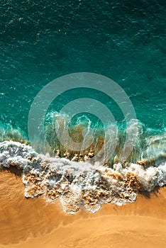 Beautiful sandy beach with turquoise sea, vertical view. Drone view of tropical turquoise ocean beach Nusa penida Bali Indonesia.