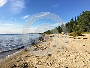 The beautiful sandy beaches along Marten Beach and the waters of slave lake in Northern Alberta, Canada on a warm summer day.