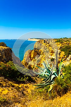 Beautiful sandy ciffs along Algarve ocean coast neer Lagos city, Portugal