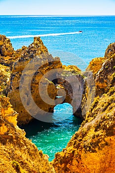 Beautiful sandy ciffs and water laggon along Algarve ocean coast neer Lagos city, Portugal