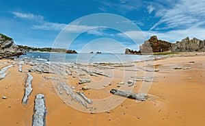 Beautiful sandy Playa Del Portio Biskaya, Cantabria, Spain summer landscape. Atlantic Ocean coastline view with rock formations photo