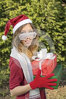 Beautiful Santa Claus girl with Christmas presents