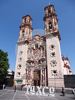 Beautiful Santa Prisca cathedral church in colonial spanish baroque style at Taxco city center in Mexico - vertical