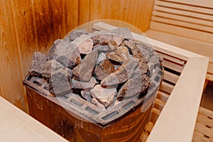 Beautiful sauna interior with heater and stones. electric sauna heater in steam room, close up view