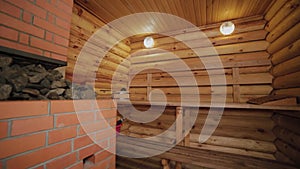 Beautiful sauna interior made of wooden logs.