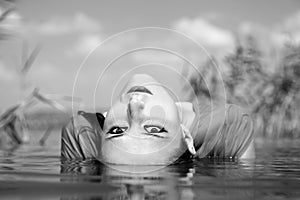 Beautiful savage girl in the river.