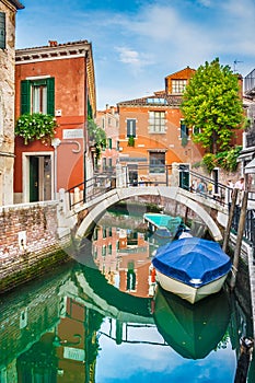 Beautiful scene with colorful houses and boats in Venice