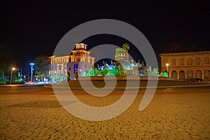 Beautiful scene of Kutaisi in a New Year night. City night plaza in autumn with paths strewn