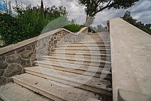 Beautiful scene of marble stairs in a streetsurrounded by plants