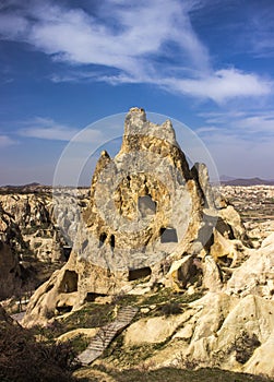 Beautiful scene of a rocky sunny hill against a blue sky in Goreme Open Air Museum in Turkey