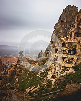 Beautiful scene of a rocky sunny hill against a blue sky at sunset