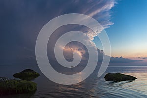 Beautiful scene with stormfront and lightning summer seascape.