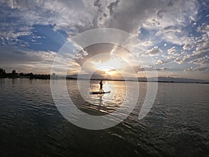Beautiful scene of sunset and SUP stand up paddle board at Yuehai lake in Yinchuan, China