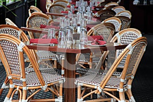 Beautiful scene of tables and cane chairs at outdoor patio of restaurant